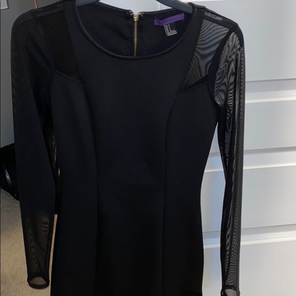 Black mini dress, sleeves are sheer